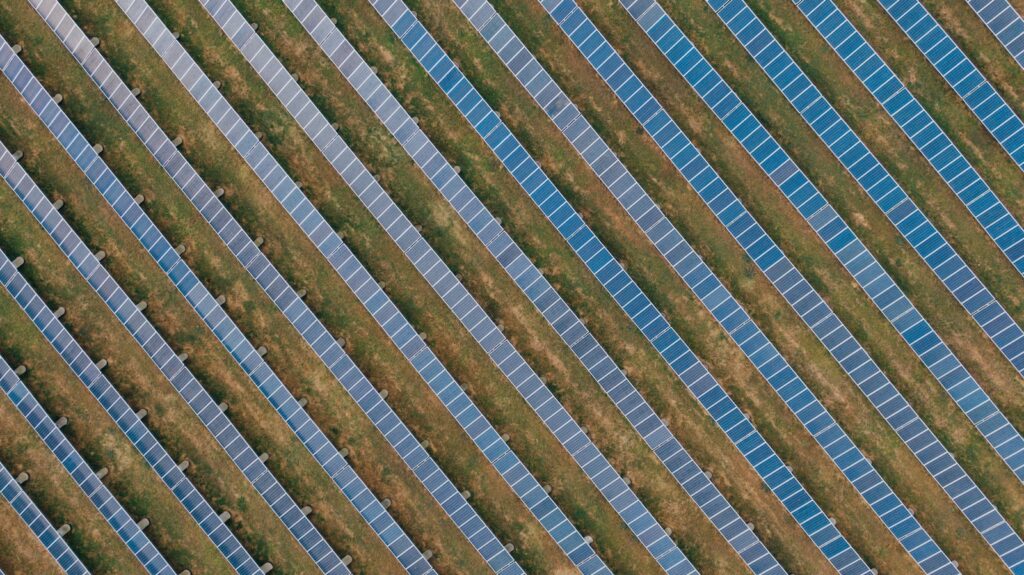 Textured background of solar panels in countryside field
