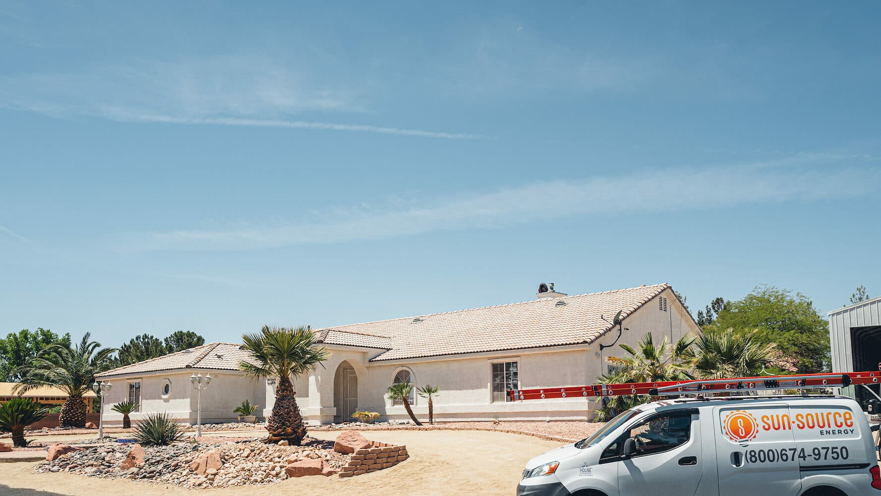 Close-up view of SunSource USA solar installation with solar panels and equipment