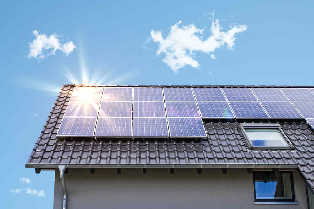 Solar panels on a roof on a sunny day.
