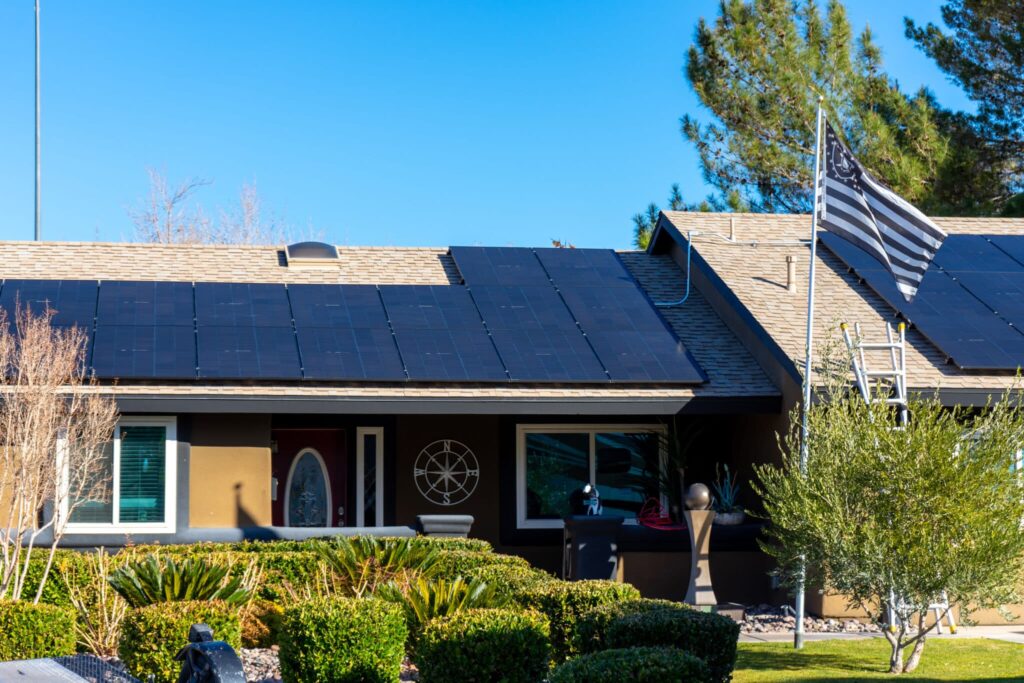 Roof with solar panels installed and flag.